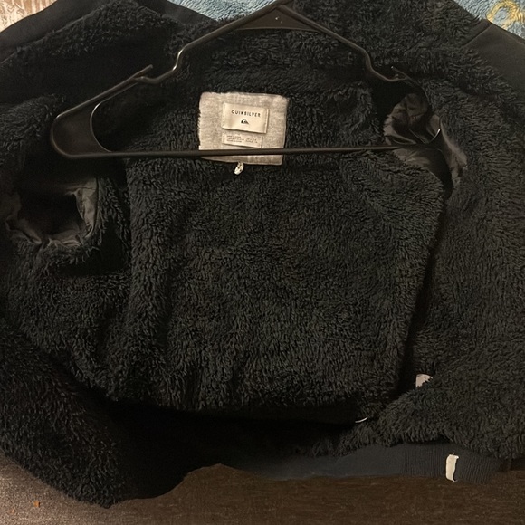 This is a zip up sweater with fuzzy cotton inside. - Picture 3 of 3